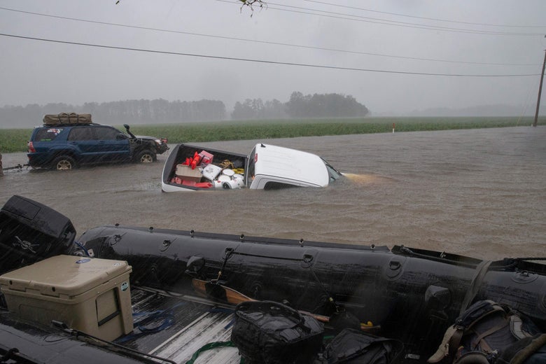A pickup truck is seen submerged in floodwater in Lumberton, North Carolina, on September 15, 2018 in the wake of Hurricane Florence.